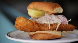 The crispy whitefish sandwich from Voyager in Ferndale is made of beer-battered Lake Superior Whitefish, lightly fermented cabbage slaw with coconut milk, a brioche bun and McClure's pickle wedge.